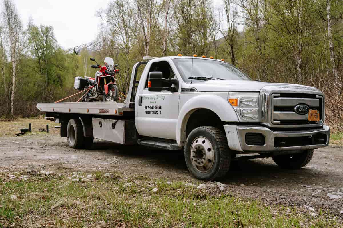 Motorcycle secured on a flatbed tow truck
